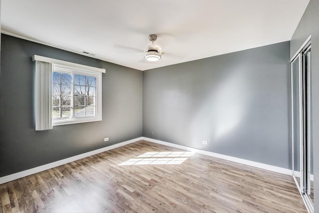 6S009 Steeple Run Dr, Naperville, IL 60540 - empty room with ceiling fan, wood finished floors, and baseboards