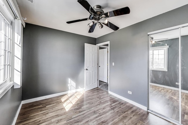 6S009 Steeple Run Dr, Naperville, IL 60540 - unfurnished bedroom with wood finished floors, baseboards, a closet, and a ceiling fan