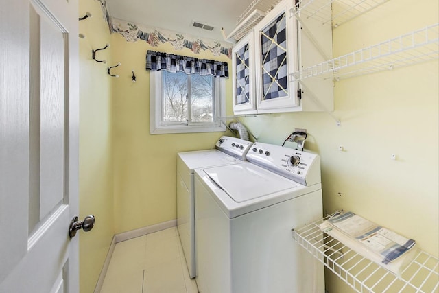 6S009 Steeple Run Dr, Naperville, IL 60540 - washroom with washer and dryer, cabinet space, baseboards, and light tile patterned floors