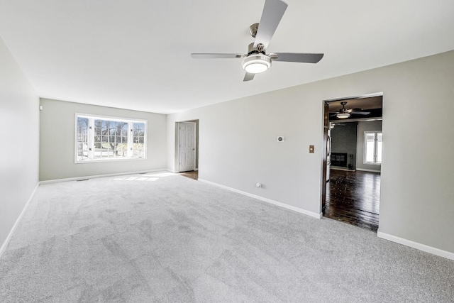6S009 Steeple Run Dr, Naperville, IL 60540 - carpeted spare room featuring a ceiling fan and baseboards