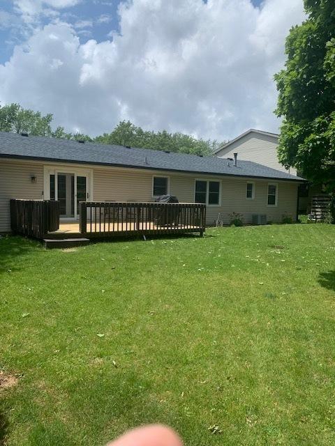 43 Kenfield Cir, Bloomington, IL 61704 - rear view of property featuring a yard, a wooden deck, and central air condition unit