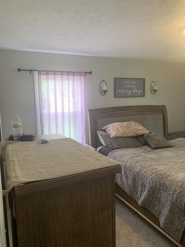 43 Kenfield Cir, Bloomington, IL 61704 - carpeted bedroom featuring a textured ceiling