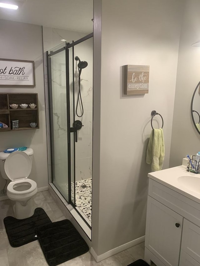 43 Kenfield Cir, Bloomington, IL 61704 - full bathroom with a shower stall, vanity, toilet, and baseboards