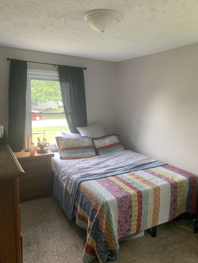 43 Kenfield Cir, Bloomington, IL 61704 - carpeted bedroom with a textured ceiling