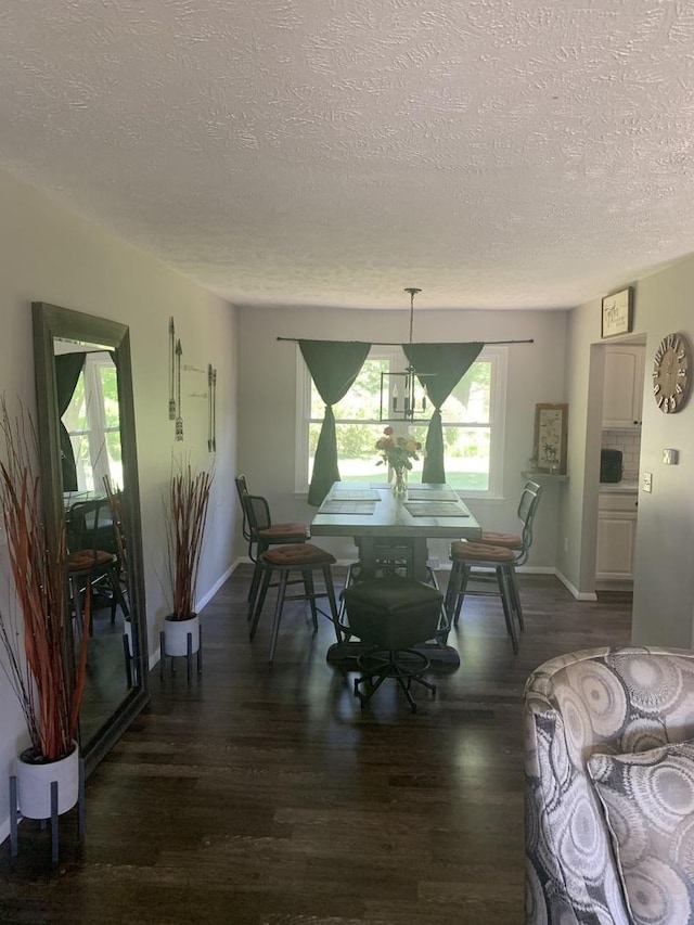 43 Kenfield Cir, Bloomington, IL 61704 - dining area with a textured ceiling, wood finished floors, and baseboards