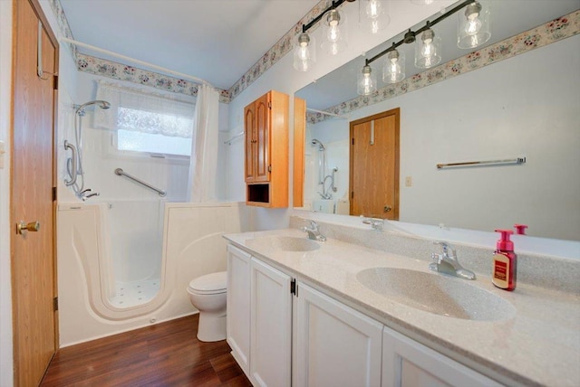 38059 N Holdridge Ave, Beach Park, IL 60087 - full bathroom featuring toilet, wood finished floors, double vanity, and bathing tub / shower combination