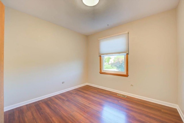 38059 N Holdridge Ave, Beach Park, IL 60087 - empty room with dark wood-type flooring and baseboards