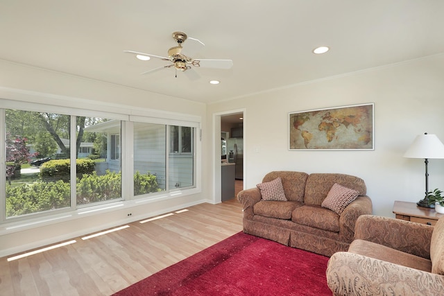2946 Knollwood Ln, Glenview, IL 60025 - living room featuring a ceiling fan, recessed lighting, wood finished floors, crown molding, and baseboards