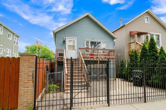 4815 S Bishop St, Chicago, IL 60638 - view of front of home with a gate, stairway, a fenced front yard, and a wooden deck