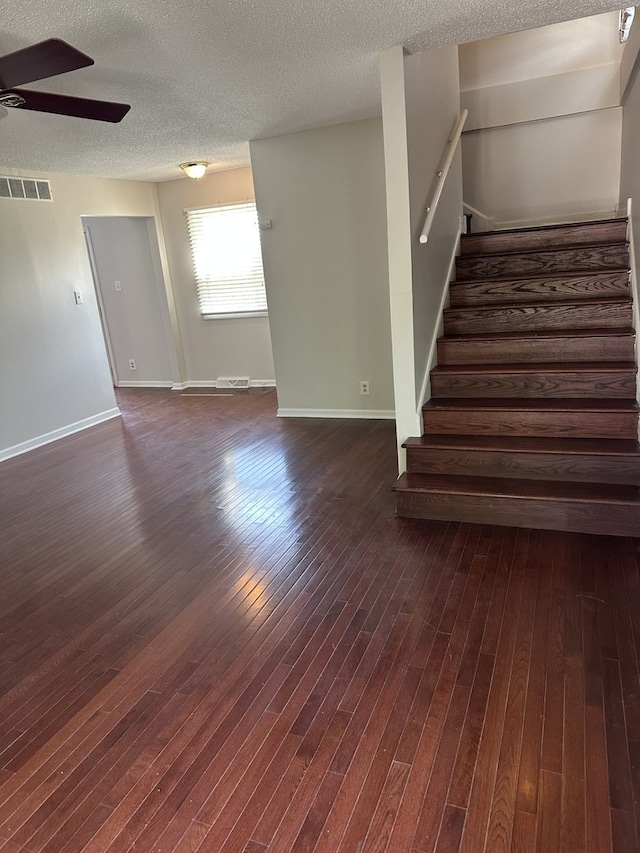 1326 Post Oak Ct Unit 1, Crest Hill, IL 60403 - empty room with ceiling fan, stairs, dark wood-style flooring, and a textured ceiling