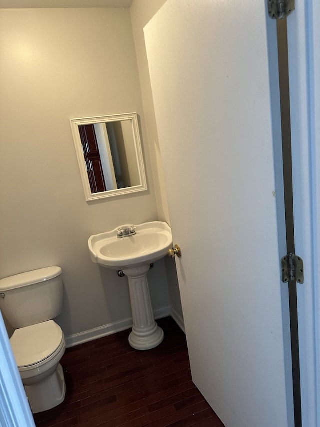 1326 Post Oak Ct Unit 1, Crest Hill, IL 60403 - bathroom with baseboards, hardwood / wood-style flooring, toilet, and a sink