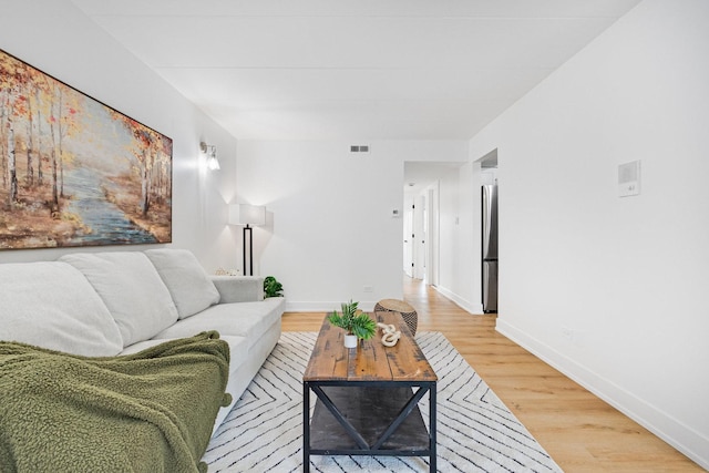 7925 Paxton Ave Unit 1A, Tinley Park, IL 60477 - living area featuring light wood finished floors and baseboards