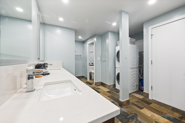 1313 N Ritchie Ct Unit 2001, Chicago, IL 60610 - full bath featuring stacked washer / dryer, recessed lighting, stone tile flooring, double vanity, and toilet