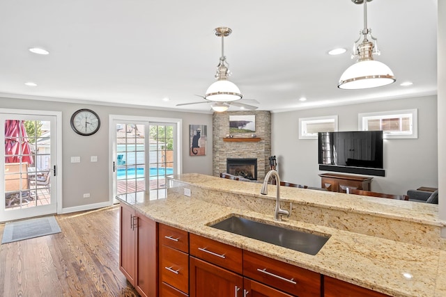 7317 W Greenleaf St, Chicago, IL 60631 - kitchen featuring a sink, open floor plan, light wood-type flooring, pendant lighting, and recessed lighting