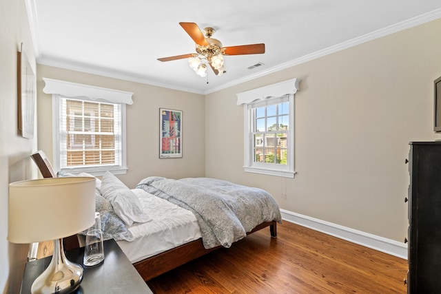 7317 W Greenleaf St, Chicago, IL 60631 - bedroom with crown molding, baseboards, wood finished floors, and a ceiling fan