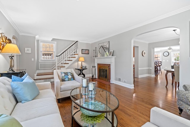 7317 W Greenleaf St, Chicago, IL 60631 - living area with arched walkways, wood finished floors, healthy amount of natural light, and ornamental molding