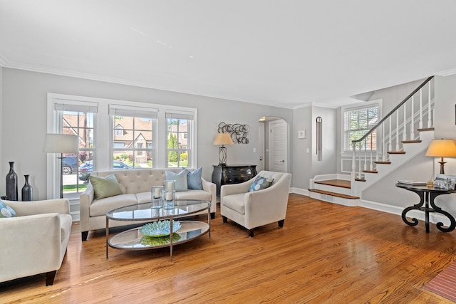 7317 W Greenleaf St, Chicago, IL 60631 - living room featuring arched walkways, stairs, crown molding, and light wood finished floors