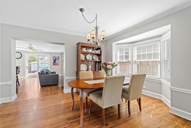 7317 W Greenleaf St, Chicago, IL 60631 - dining room with a chandelier, ornamental molding, light wood-type flooring, and baseboards