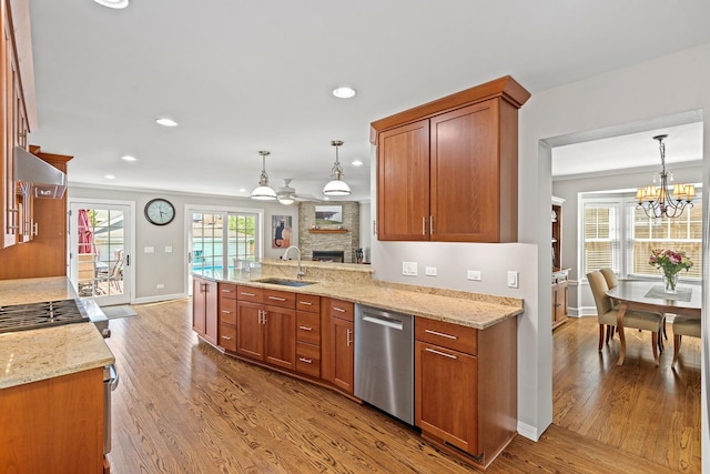 7317 W Greenleaf St, Chicago, IL 60631 - kitchen with appliances with stainless steel finishes, a sink, a fireplace, wood finished floors, and baseboards