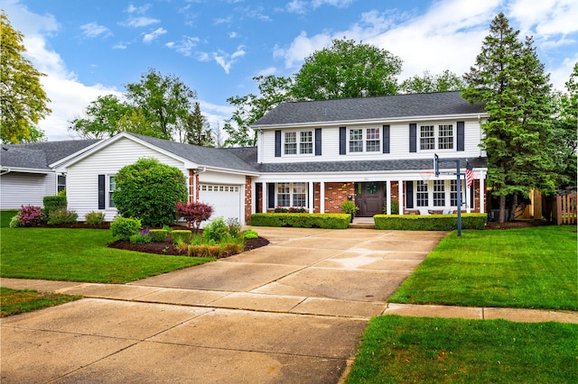 2S151 Stratford Rd, Glen Ellyn, IL 60137 - traditional-style home with a porch, a front lawn, driveway, an attached garage, and brick siding
