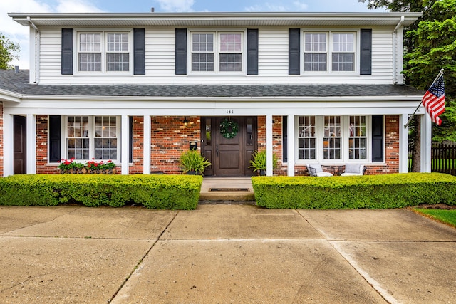 2S151 Stratford Rd, Glen Ellyn, IL 60137 - traditional-style home with brick siding and a porch