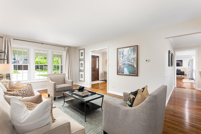 2S151 Stratford Rd, Glen Ellyn, IL 60137 - living area featuring wood finished floors, baseboards, and crown molding