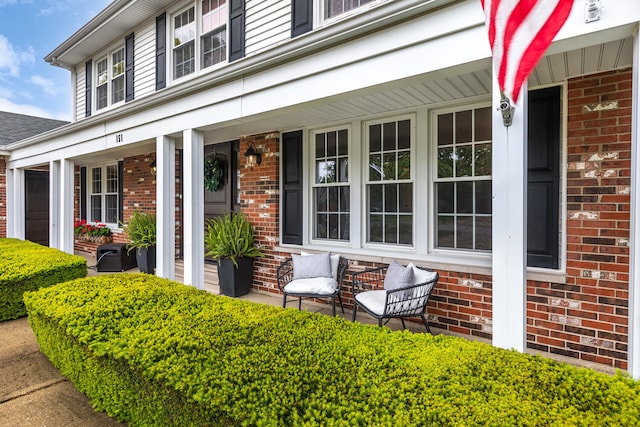 2S151 Stratford Rd, Glen Ellyn, IL 60137 - view of exterior entry featuring a porch and brick siding