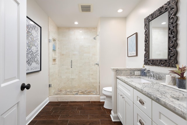 2S151 Stratford Rd, Glen Ellyn, IL 60137 - bathroom with toilet, vanity, a shower stall, wood tiled floors, and baseboards