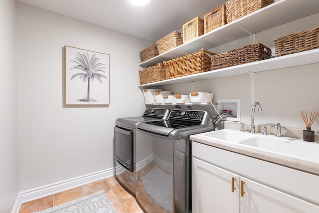 2S151 Stratford Rd, Glen Ellyn, IL 60137 - laundry room with washer and clothes dryer, cabinet space, baseboards, and light tile patterned floors