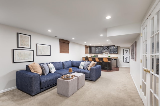 2S151 Stratford Rd, Glen Ellyn, IL 60137 - living room featuring bar with sink, light carpet, french doors, recessed lighting, and baseboards