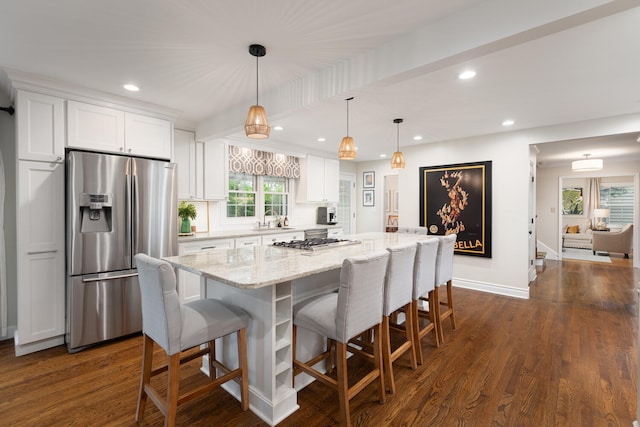 2S151 Stratford Rd, Glen Ellyn, IL 60137 - kitchen featuring stainless steel appliances, a sink, white cabinets, a breakfast bar area, and recessed lighting