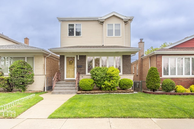 5148 S Newland Ave, Chicago, IL 60638 - traditional-style home with a front yard and brick siding