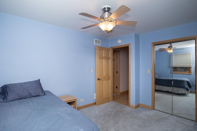 5148 S Newland Ave, Chicago, IL 60638 - bedroom featuring carpet flooring, a closet, baseboards, and a ceiling fan