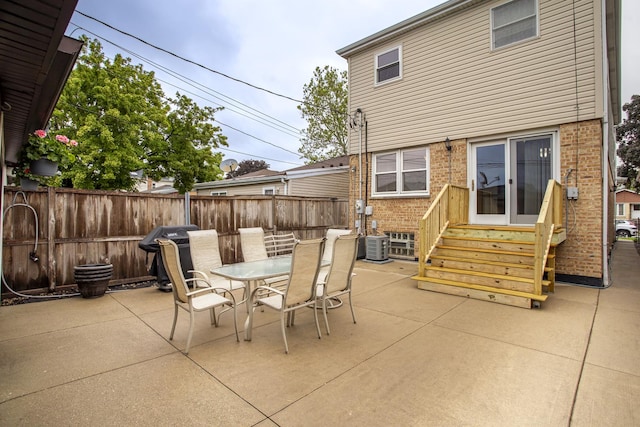 5148 S Newland Ave, Chicago, IL 60638 - fenced backyard featuring entry steps, a patio, and outdoor dining space