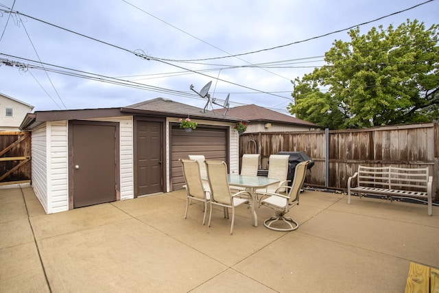 5148 S Newland Ave, Chicago, IL 60638 - fenced backyard featuring a patio area, an outbuilding, and outdoor dining space