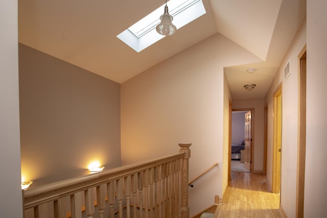 5148 S Newland Ave, Chicago, IL 60638 - hall with a skylight, an upstairs landing, light wood-type flooring, and lofted ceiling