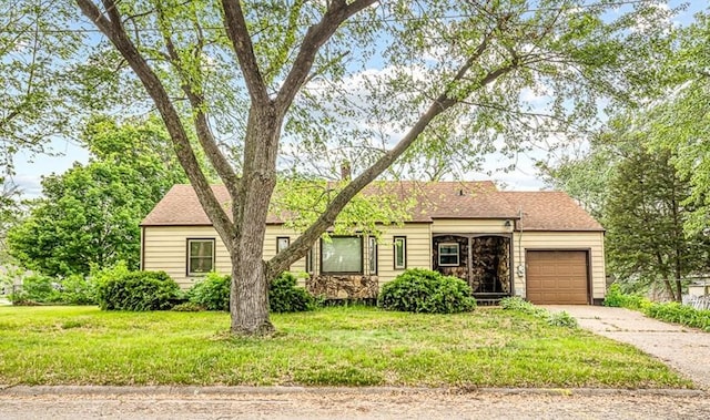 530 Fitch Rd, Rockford, IL 61109 - ranch-style house featuring a garage, concrete driveway, and a front yard