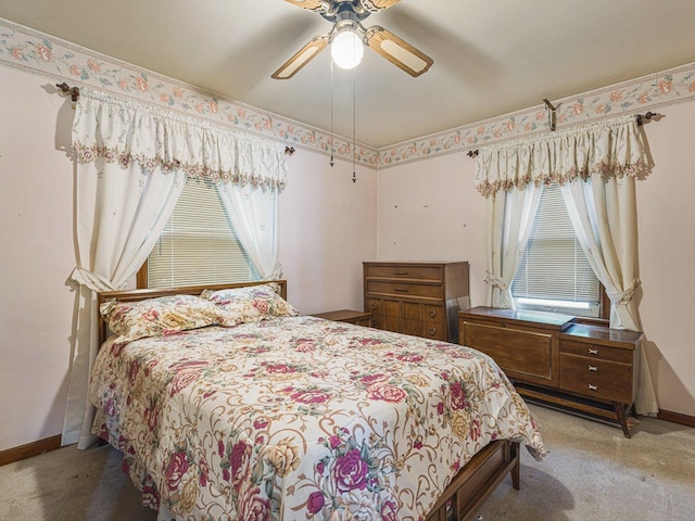 530 Fitch Rd, Rockford, IL 61109 - bedroom with multiple windows, baseboards, and carpet