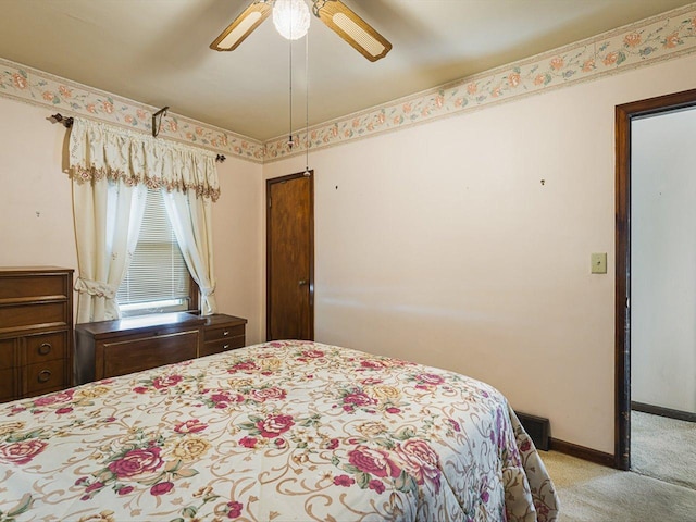 530 Fitch Rd, Rockford, IL 61109 - bedroom with light carpet, baseboards, and a ceiling fan
