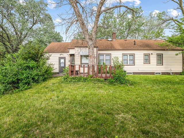 530 Fitch Rd, Rockford, IL 61109 - back of house with a chimney, a yard, and a wooden deck