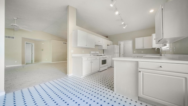 5008 Thistle Trl, Loves Park, IL 61111 - kitchen featuring gas range gas stove, a sink, light countertops, white cabinets, and vaulted ceiling