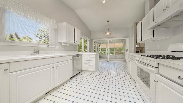 5008 Thistle Trl, Loves Park, IL 61111 - kitchen with white gas range oven, vaulted ceiling, white cabinetry, light countertops, and stainless steel dishwasher