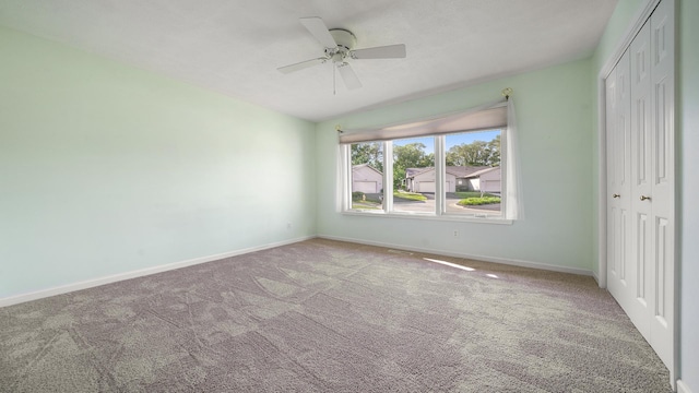 5008 Thistle Trl, Loves Park, IL 61111 - unfurnished bedroom with a closet, carpet, baseboards, and a ceiling fan