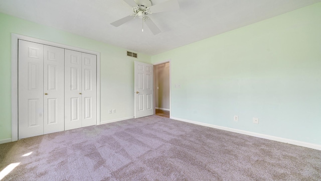 5008 Thistle Trl, Loves Park, IL 61111 - unfurnished bedroom with carpet, baseboards, a closet, and ceiling fan
