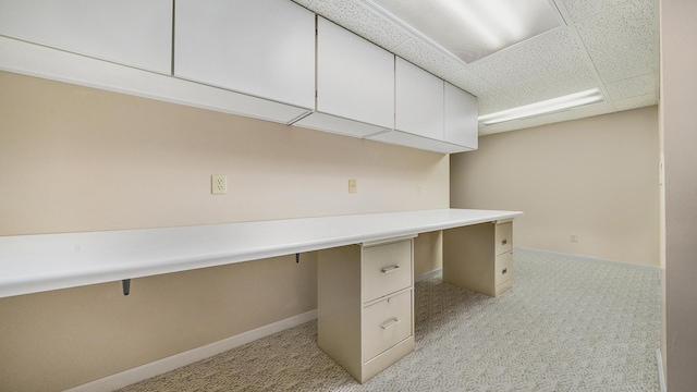 5008 Thistle Trl, Loves Park, IL 61111 - unfurnished office with light carpet, baseboards, built in study area, and a paneled ceiling