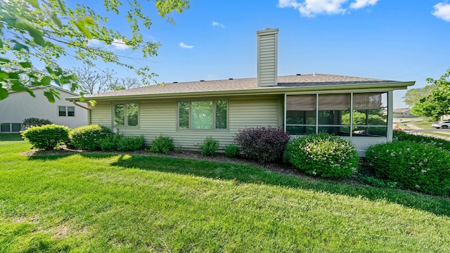 5008 Thistle Trl, Loves Park, IL 61111 - rear view of property featuring a yard and a chimney