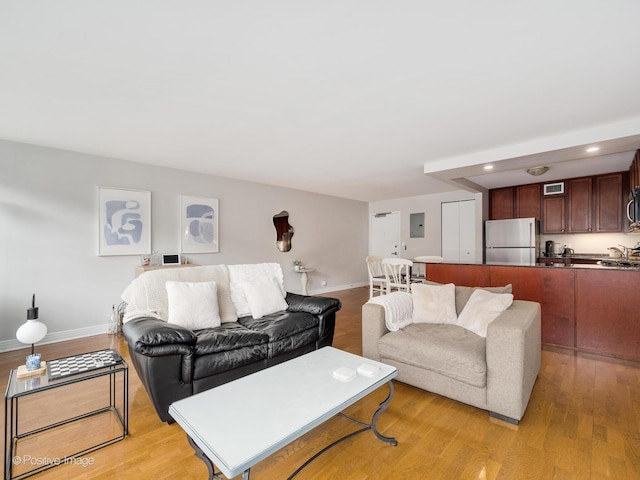 2300 N Commonwealth Ave Unit 2L, Chicago, IL 60614 - living area featuring light wood-style flooring, baseboards, recessed lighting, and electric panel