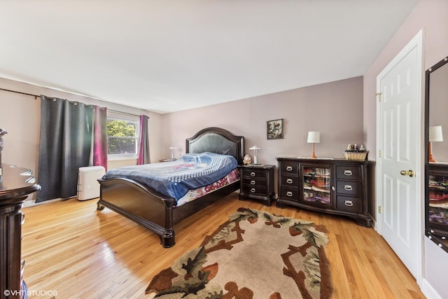 bedroom featuring wood finished floors