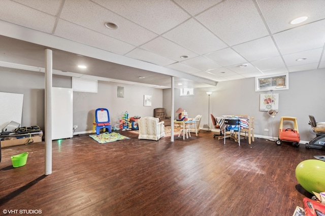 rec room with wood finished floors, baseboards, a paneled ceiling, and recessed lighting