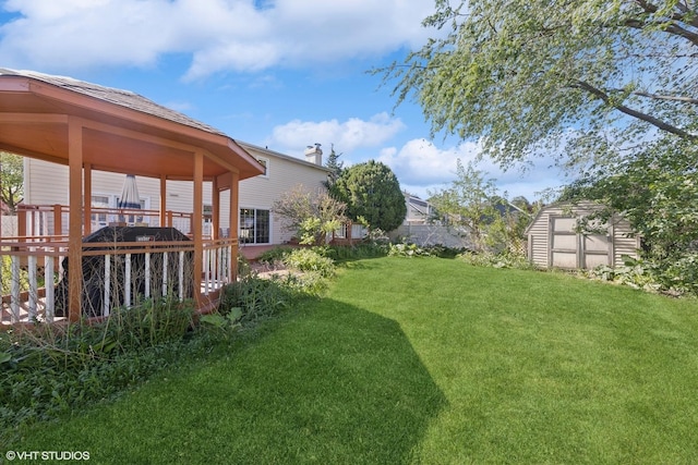 view of green lawn with a deck